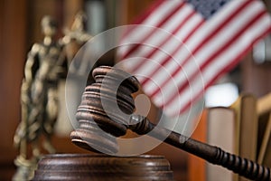 Wooden gavel on wooden table,legal books background