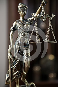 Wooden gavel on wooden table,legal books background
