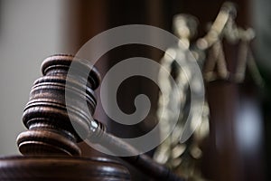 Wooden gavel on wooden table,legal books background