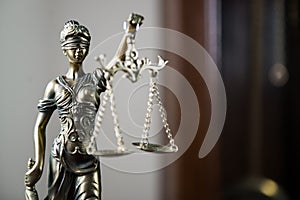 Wooden gavel on wooden table,legal books background