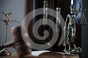 Wooden gavel on wooden table,legal books background