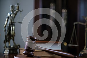 Wooden gavel on wooden table,legal books background