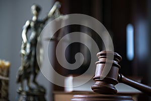 Wooden gavel on wooden table,legal books background