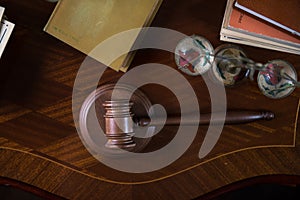 Wooden gavel on wooden table,legal books background