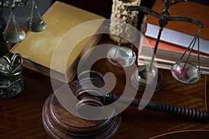 Wooden gavel on wooden table,legal books background