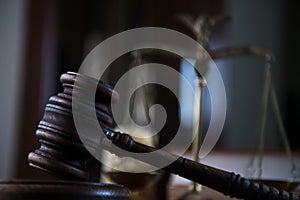 Wooden gavel on wooden table,legal books background