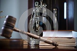 Wooden gavel on wooden table,legal books background