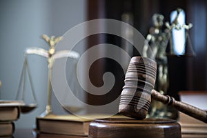 Wooden gavel on wooden table,legal books background