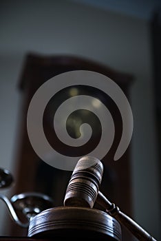 Wooden gavel on wooden table,legal books background