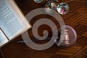 Wooden gavel on wooden table,legal books background