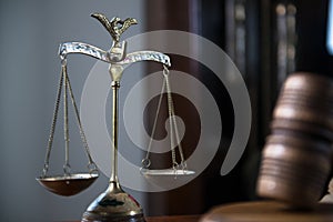 Wooden gavel on wooden table,legal books background