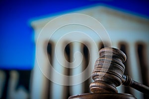 Wooden gavel on wooden table,legal books background