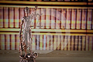 Wooden gavel on wooden table,legal books background