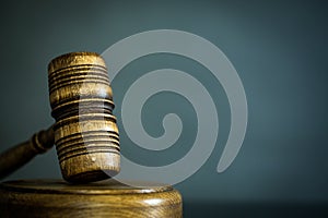 Wooden gavel on wooden table,legal books background