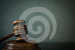 Wooden gavel on wooden table,legal books background