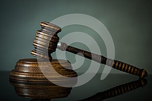 Wooden gavel on wooden table,legal books background