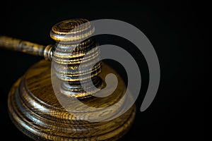 Wooden gavel on wooden table,legal books background