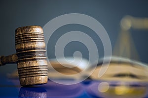 Wooden gavel on wooden table,legal books background