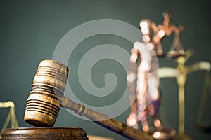 Wooden gavel on wooden table,legal books background