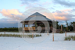 Wooden gazebo at the beach in sunset