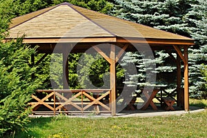 Wooden gazebo in spring parks