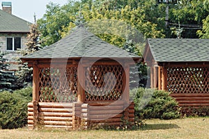 Wooden gazebo standing on the territory near the estate