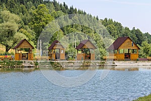 Wooden gazebos on shore of lake