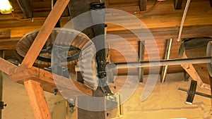 Wooden gears turning in a working windmill at oatlands in tasmania