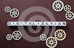 Wooden gears with word Digitalization. Digitalization Concept