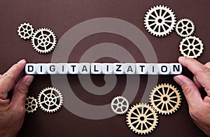 Wooden gears with word Digitalization. Digitalization Concept