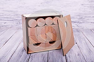 Wooden geometric figures in the wooden box. Education concept.