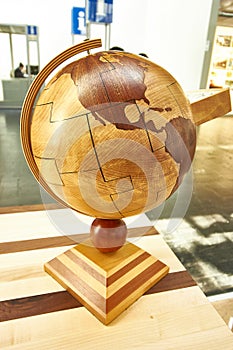 Wooden globe facing America