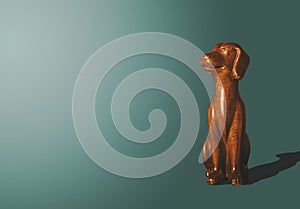 Wooden, gold doggy figurine.