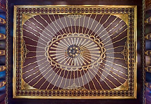 Wooden golden ornate ceiling with design based on sun rays inspired by the old flag of the ottoman empire, Cairo, Egypt