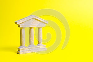 wooden government building on a yellow background. The authorities, the sovereignty of the country and the rule of law.