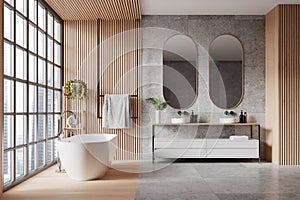 Wooden and gray bathroom interior with tub and double sink