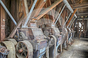 Wooden grist mill equipment in abandoned factory