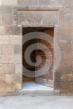 Wooden grunge old door and stone bricks wall, Old Cairo, Egypt photo