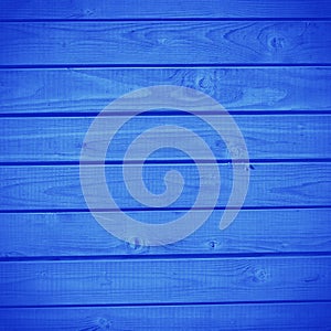 Wooden grunge texture background made of Classic Blue 2020 color. Color of year 2020 blurred sparkling backdrop for holidays and