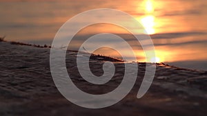 Wooden gunwale of an old sailing ship at sunset. Slow motion video