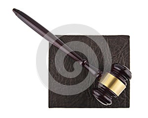 wooden hammer and book isolated on white