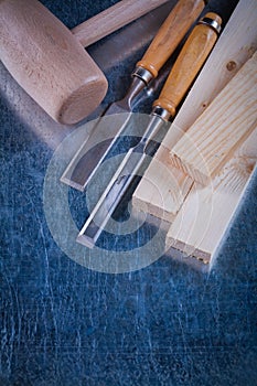 Wooden hammer studs and firmer chisels on