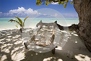 Wooden hammock at exotic beach