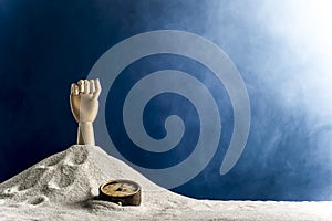 Wooden hand gesticulating against a blue background