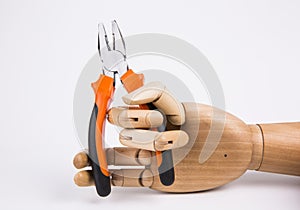 Wooden hand holding Pliers