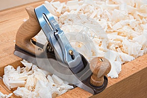 Wooden hand plane for woodworking with wood shavings