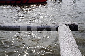 Wooden hand rail along a pier