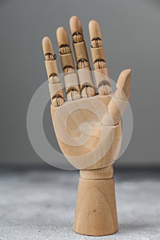 The wooden hand shows a gesture of openness. The concept of communication