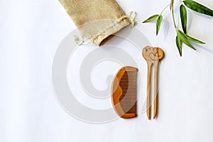 Wooden handmade hair pin and comb on white background. Japanese style hair accessories.