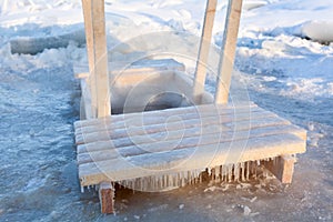 Wooden handrail for dipping in ice hole water